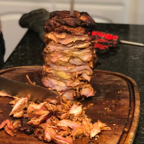 Stack of pork and pineapple still on the Joetisserie skewer and part way through carving.