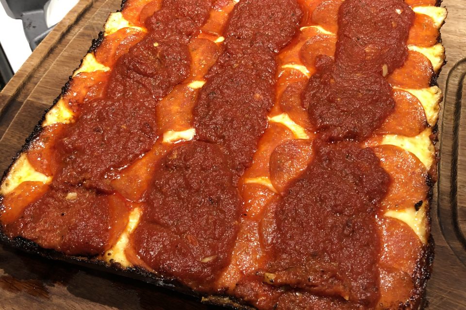 A finished Detroit Style Pizza