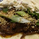 Close up shot of the served up Chinese Pork with all the trimmings.