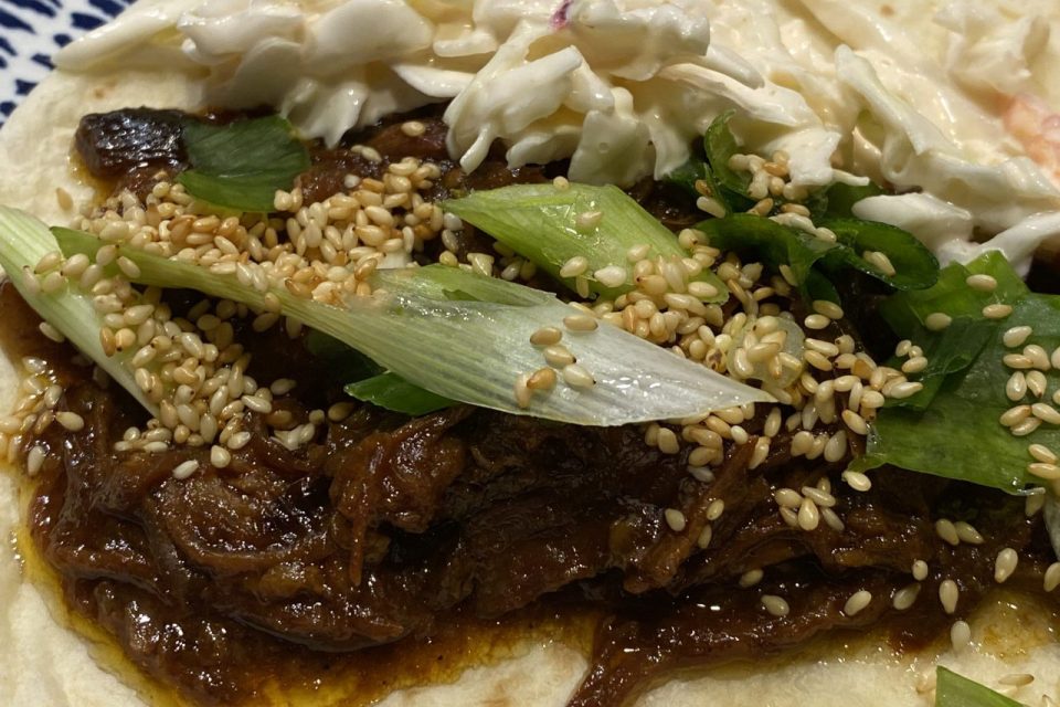 Close up shot of the served up Chinese Pork with all the trimmings.
